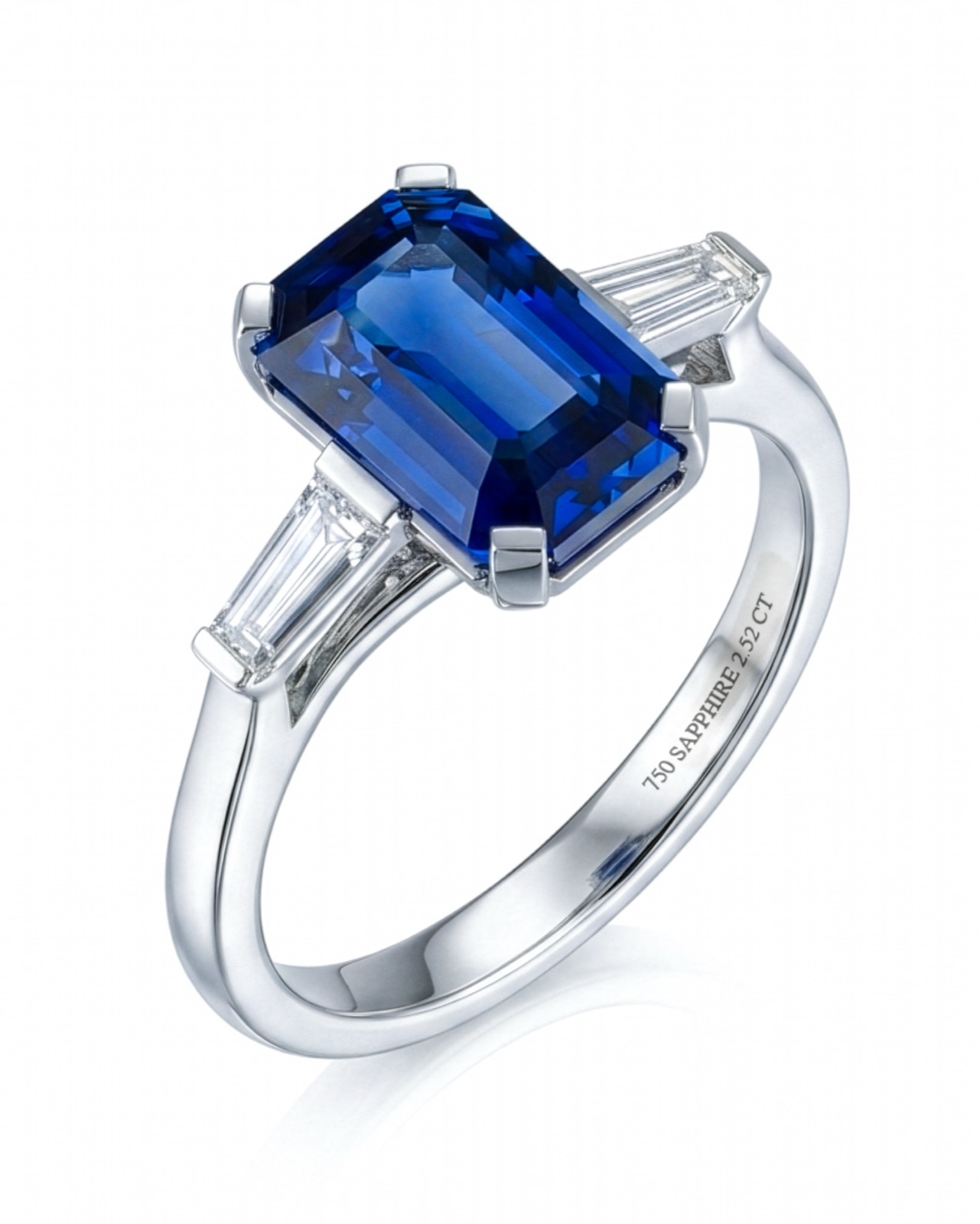 Emerald-cut sapphire ring with tapered baguette diamonds in platinum