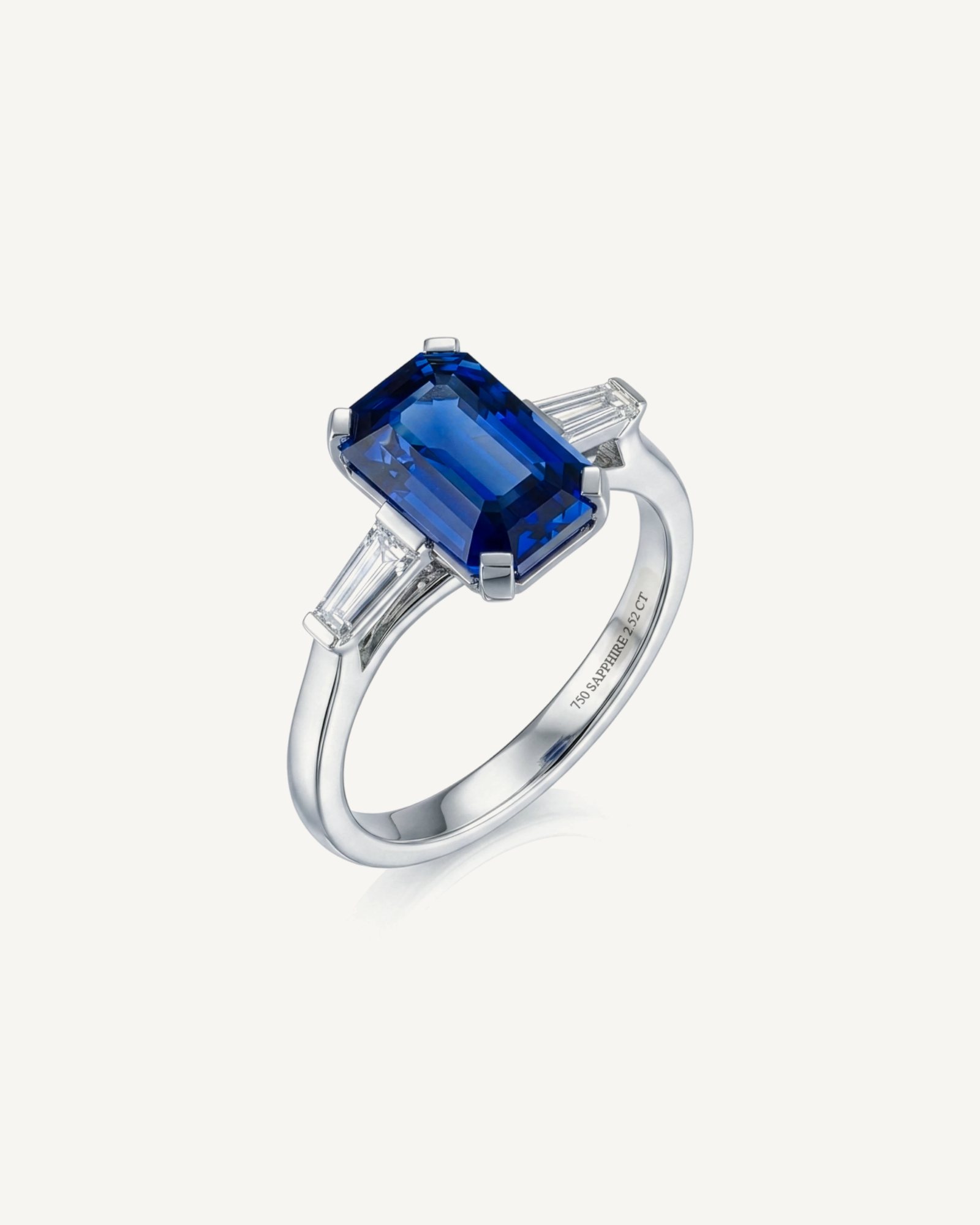 Octagonal sapphire ring with tapered baguette diamonds in white gold