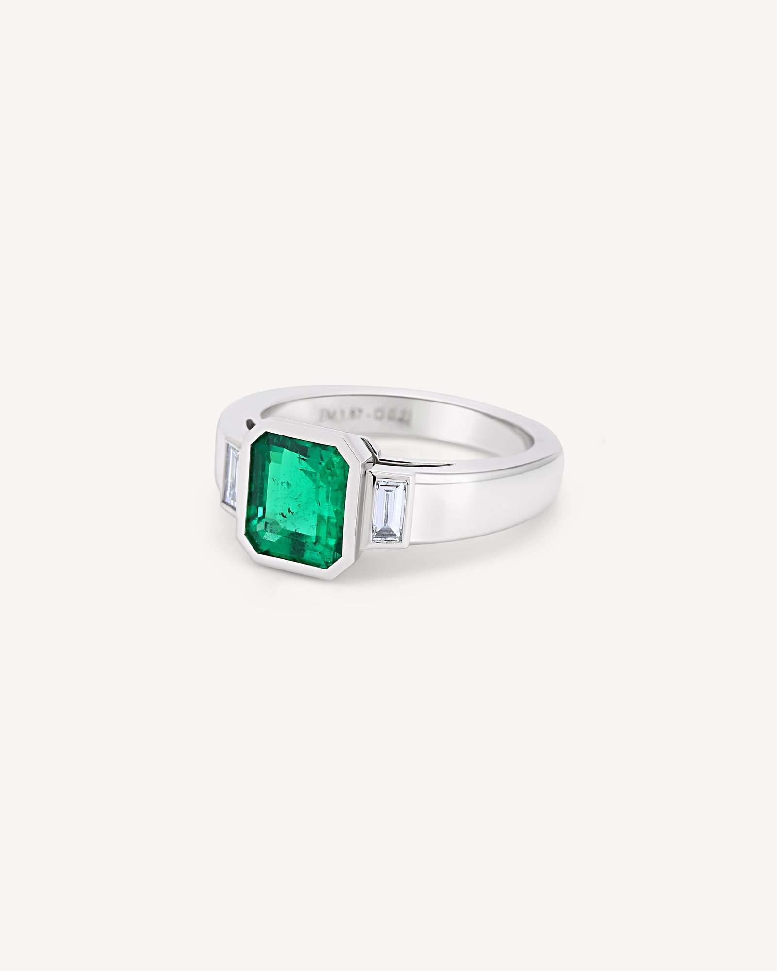 The same emerald ring seen from the side